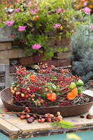 Wreath of clematis, physalis and branches of berries