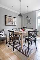 Dining area in open kitchen with light grey walls