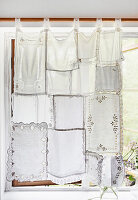 Window with DIY curtain made from lace doilies