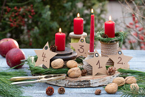 Unusual Advent wreath made of yarn rolls and red candles
