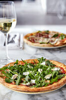 Pizza with rocket and cheese