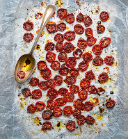 Sun-dried tomatoes with olive oil on baking paper