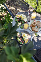 Autumn brunch with omelette, figs, and salad outside