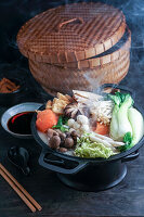 Hot pot with Chinese cabbage and mushrooms, cooked in a creamy and hearty soy milk broth