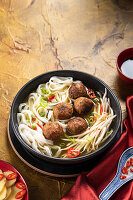 Asian style noodle soup with vegan meatballs