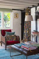 Vintage armchair with cushion and coffee table with leather upholstery in rustic living room