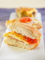 Mini-sandwich of ciabatta with ham and cheese omelette