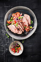 Grilled Iberico Secreto with olive and tomato salad