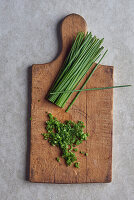 Chopped chives on a wooden board
