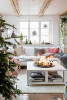 Upholstered sofa with cushions and coffee table in Christmas living room