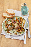 Winter dinner of pork medallions with Gorgonzola sauce and pear wedges