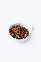 Golden raisins in a cup