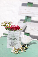 Gift bags with spring bouquets and decorative bird