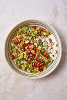 Low-carb broccoli tabouleh with almonds and pomegranate seeds