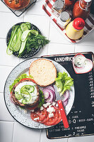 Greek burger with lamb, feta, cucumber, and dill yogurt sauce