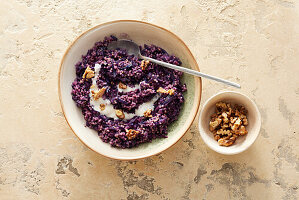 Vegan hirsotto with red cabbage and walnuts