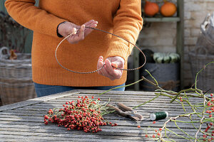 Heart of rose hips on a bent wire wreath blank