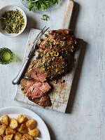 Butterflied leg of lamb with preserved lemon, green olives, capers and dill