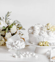 Wedding cake with cream roses and dragee almonds