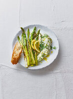 Green asparagus with creamy goat cheese and herb couscous