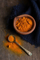 Turmeric powder in a clay bowl