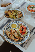 Grilled fish with salad and dressing