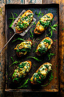 Baked potatoes filled with rocket and gorgonzola cheese