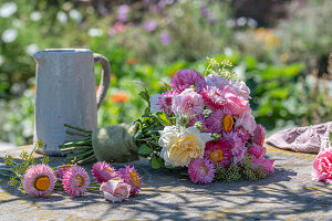 Bouquet with roses and strawflowers