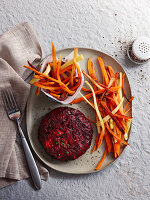 Beetroot burger with rainbow straw potatoes