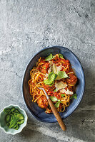 Spaghetti with pork meatballs, parmesan, and basil