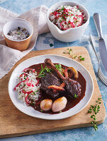 Rooster braised in wine with mushrooms