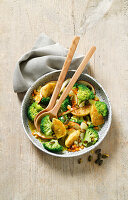 Dumpling and broccoli salad with pumpkin seed dressing