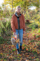 Woman with picnic basket on an autumn walk