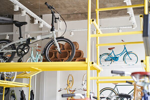 Shot of numerous bicycles stored inside a bicycle shop
