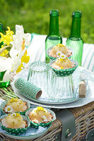 Muffins with pistachios and edible flowers (primroses and daisies)