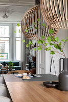 Wooden table with modern pendant lights in the dining room