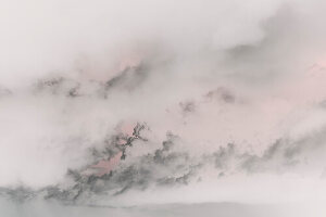 Abstract of clouds and sky at dusk, black grey and pink colours. 