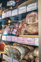 Charcuterie on display at a market in Brittany