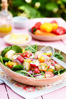 Summer bounty salad with potatoes, spinach, and tomatoes