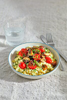 Vegan cauliflower risotto with tomatoes and mushrooms