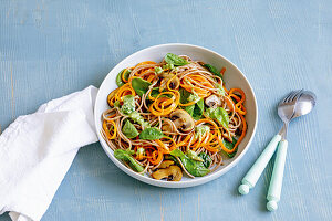 Carrot pasta with spinach and nut pesto