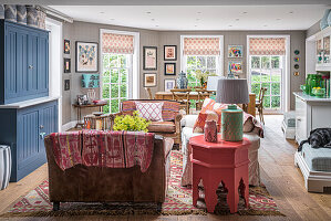 Country-style living room with blue accent furniture and patterned decoration