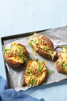 Sweet potato kumpir with savoy cabbage and cheese filling