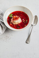 Vegan dumplings in red root stock with horseradish