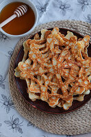 Spider web pancakes with maple syrup