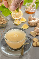 Hot cold drink with lemon, ginger, honey and fennel