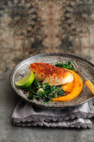 Red snapper with ras el-hanout on pumpkin-apricot cream and sesame spinach