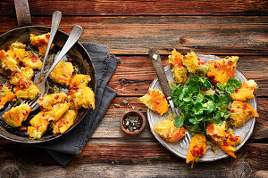 Potato pancake with leek and mountain root with lamb's lettuce and quince dressing