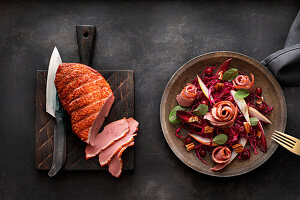 Smoked duck breast with red cabbage and pear salad, cranberries and pecans