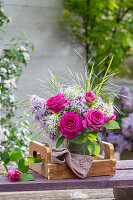 Bouquet of lilac (Syringa vulgaris), rose (Rosa) 'Fräulein Maria', wild garlic flowers and woodruff on garden bench